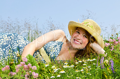 Young girl laying on meadow