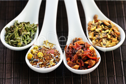 Assorted herbal wellness dry tea in spoons