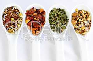 Assorted herbal wellness dry tea in spoons