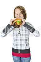 Teenage girl eating big hamburger