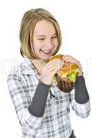 Teenage girl holding big hamburger