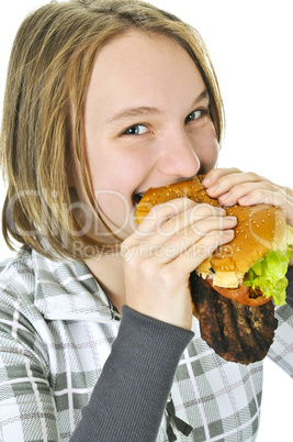 Teenage girl holding big hamburger