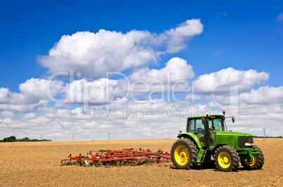 Tractor in plowed field