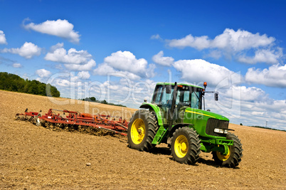 Tractor in plowed field