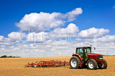 Tractor in plowed field