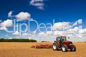 Tractor in plowed field