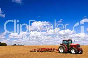 Tractor in plowed field