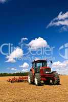 Tractor in plowed field