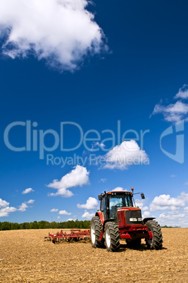 Tractor in plowed field