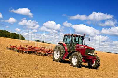 Tractor in plowed field