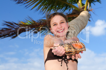 Young girl with seashell