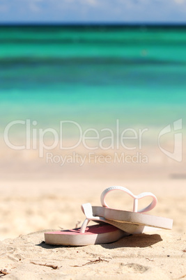 Flipflops on a sandy beach