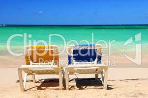 Chairs on sandy beach