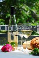 White wine with glasses outside