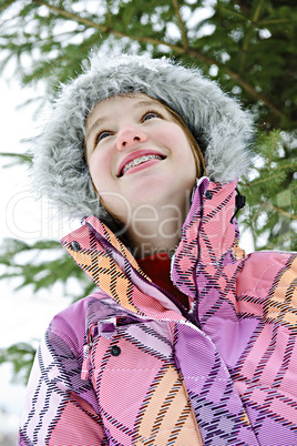Happy young girl in winter jacket