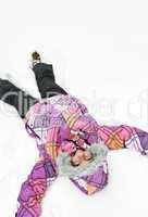 Girl making snow angel