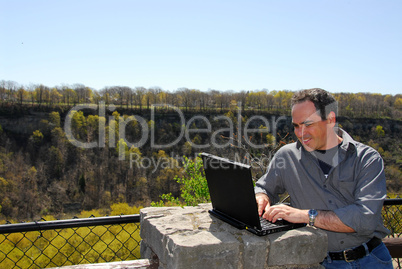 Smiling man working outdoors