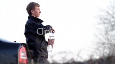 boy drinks mineral water.