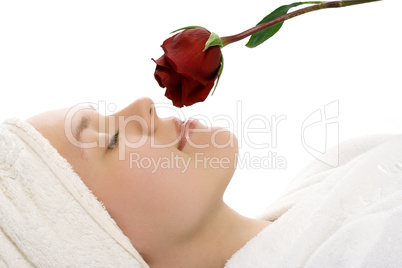 beauty girl in towel with rose after shower