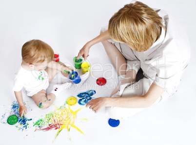 young mother with beauty baby paint on white background