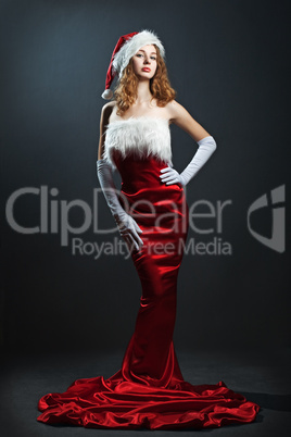 portrait of a  christmas woman in beauty red dress