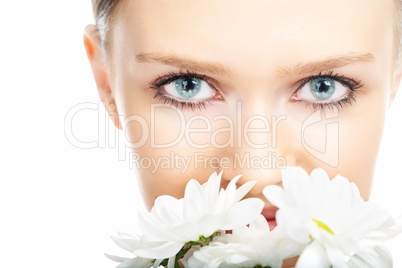 beauty woman close-up face with camomile flower
