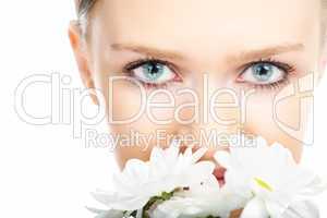 beauty woman close-up face with camomile flower
