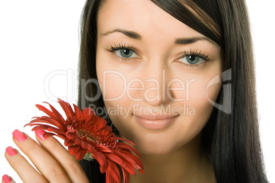 Young pretty woman holding red gerbera flower