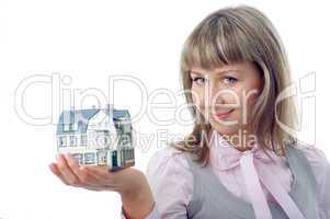woman with little house on hand