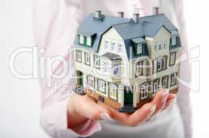 woman hand with little house