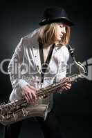 woman play on saxophone