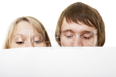 two young business people show white sign