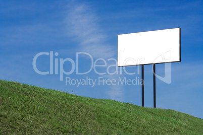 blue sky  green grass clouds and white bill board