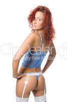 Beautiful lingerie redheaded model posing