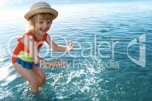 little girl in blue water sea