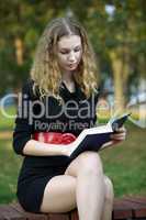 young beauty woman autumn with book