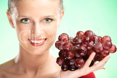 young beauty woman with grapes