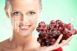 young beauty woman with grapes