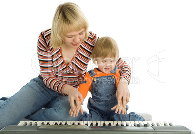 mother teach  baby play piano