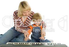 mother teach  baby play piano