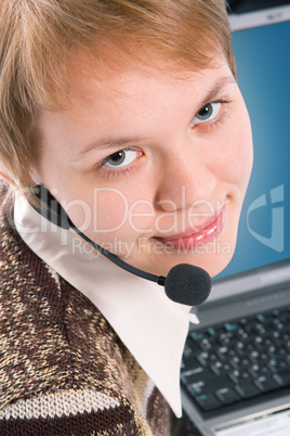 beautiful customer support girl with laptop in headphones and microphone