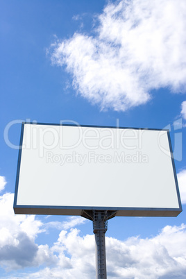 white billboard on blue sky with clouds