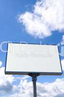 white billboard on blue sky with clouds
