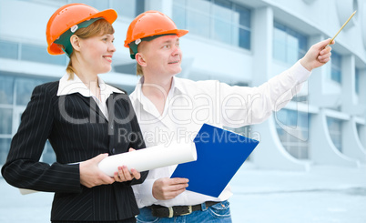 architects man and woman  protective helmet