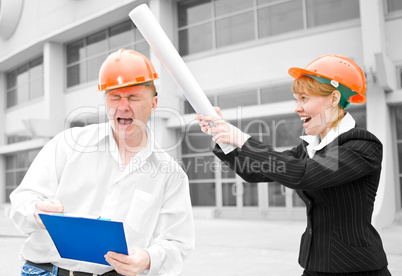 architects man and woman  protective helmet