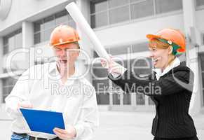 architects man and woman  protective helmet