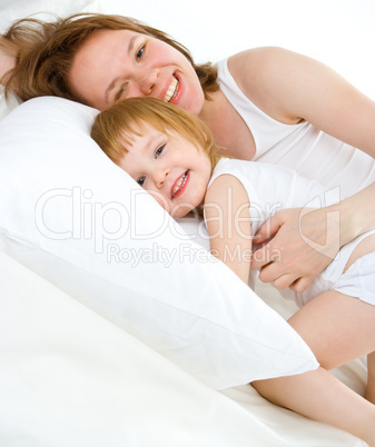 mother an baby in bed