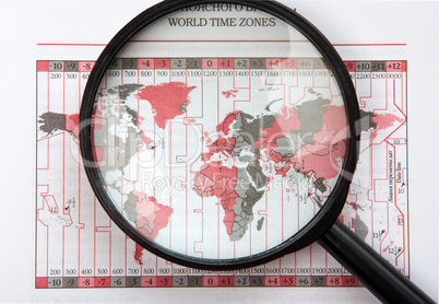 magnifier on world map with time zones