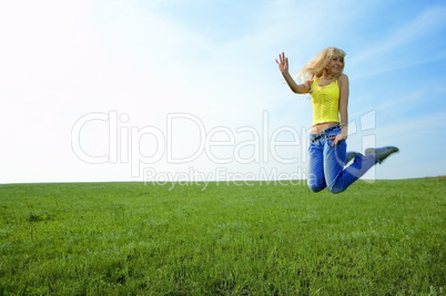 happy beauty young woman jump in field