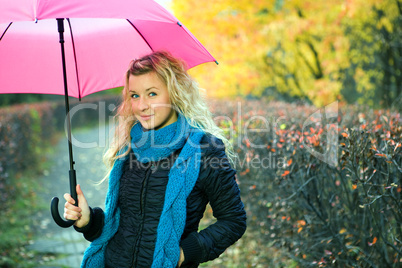 young woman in autumn yellow forest